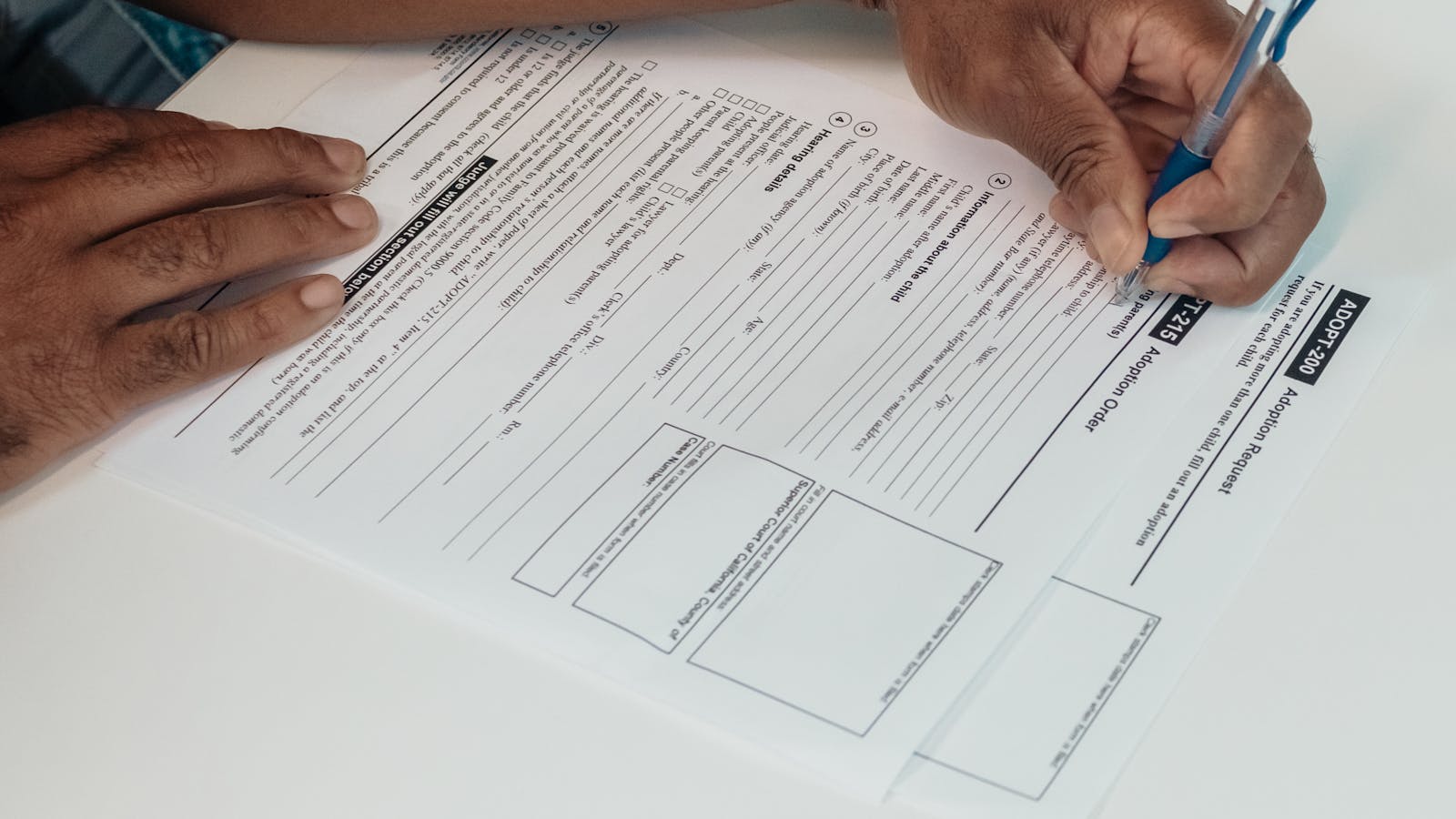 Immigrant family reviewing immigration and tax documents together at home